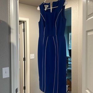 Blue with white piping accents hidden zipper in back